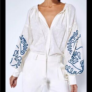 Alexis blouse with snap closure and tassel neck tie